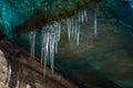 Sharp icicles hanging on the edge of the balcony. Melting snow forms icicle Royalty Free Stock Photo