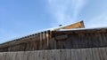 Sharp icicles from melted snow hanging from eaves of roof. Beautiful transparent icicles. Icicles on the eaves of the Royalty Free Stock Photo