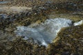 Sharp Jagged Lava Rock with a Tidal Pool Royalty Free Stock Photo