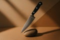 Knife balanced on a smooth stone in a minimalist setting with soft lighting and geometric shapes Royalty Free Stock Photo