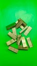 refill sharp metal stapler with green backround