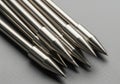 Sharp metallic points of multiple sewing machine needles arranged in a row Royalty Free Stock Photo
