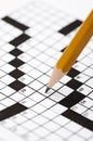 A sharp pencil on a crossword puzzle Royalty Free Stock Photo