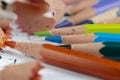 sharp pencil of different colors on paper close-up Royalty Free Stock Photo
