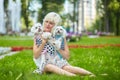 Almost sharp photo. adult woman in the park with two Maltese lapdogs