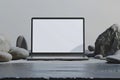 Laptop Mockup with White Screen and Natural Stones Royalty Free Stock Photo