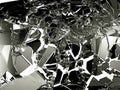 Sharp Pieces of shattered black glass on white Royalty Free Stock Photo