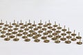 Sharp pins pointing upwards on blurred white background Royalty Free Stock Photo