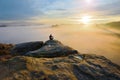 Sharp rear man silhouette on rocky peak. Satisfy hiker enjoy view. Tall man on rocky cliff