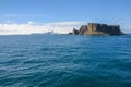 Rocky island in Antarctic waters Royalty Free Stock Photo