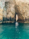 Sharp rock cliff in the beautiful and quiet shore Mediterranean waters in Malta Island Royalty Free Stock Photo