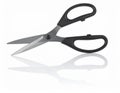 Sharp Silver Scissors with Black Handles Isolated on White Background Reflecting Royalty Free Stock Photo
