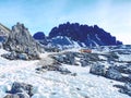 Sharp stones stacked into pyramid. Mountain ridge in Italian Alps Royalty Free Stock Photo