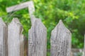 Sharp triangular tops of a wooden fence on a garden in the morning with texture wood Royalty Free Stock Photo