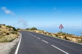 Sharp turn of the mountain road with sharp bend left road sign. Teide National Park, Tenerife, Canary Islands, Spain Royalty Free Stock Photo