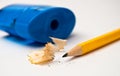 Sharp yellow pencil with blue sharpener Royalty Free Stock Photo