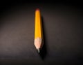 Sharp Yellow Pencil with Freshly Sharpened Tip on Smooth Surface Royalty Free Stock Photo