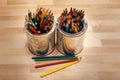 Sharped bunches of coloring pencils in metal paint cans graphic resource