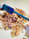 Sharpen the blue pencil. A pencil sharpener sharpened a blue pencil Royalty Free Stock Photo