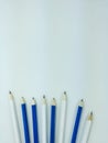 Sharpen white and blue pencils on white background with copy space on top. Royalty Free Stock Photo