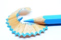 Sharpened blue color pencil and wood shavings Royalty Free Stock Photo