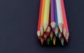 Sharpened colored pencils on a black background Royalty Free Stock Photo