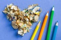 Sharpened colored pencils and pencil shavings in the shape of a heart Royalty Free Stock Photo