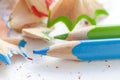 Sharpened colorful blue and green pencils and wood shavings, drawing concept Royalty Free Stock Photo