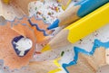 Sharpened colorful blue and yellow pencils and wood shavings, drawing concept Royalty Free Stock Photo