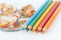 Sharpened colorful pencils and wood shavings, closeup macro Royalty Free Stock Photo