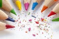 Sharpened colorful pencils and wood shavings, closeup Royalty Free Stock Photo