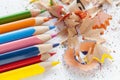 Sharpened colorful pencils and wood shavings, closeup Royalty Free Stock Photo