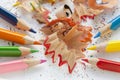 Sharpened colorful pencils and wood shavings, closeup Royalty Free Stock Photo