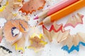 Sharpened colorful pink and orange pencils and wood shavings, drawing concept Royalty Free Stock Photo