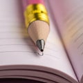 The pencil\'s graphite tip lightly touches the page, preparing to make a Royalty Free Stock Photo