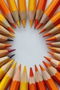 Sharpened pencils arranged in a circular pattern on a white surface, top view Royalty Free Stock Photo