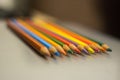 Sharpened pencils of different colors with a focus in the foreground.