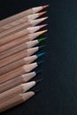 Sharpened pencils of different colors made of light wood