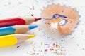 Sharpened red, yellow, blue pencils and wood shavings, drawing concept Royalty Free Stock Photo