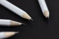 Sharpened white pencil of black background Royalty Free Stock Photo