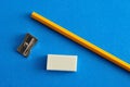 A sharpener, eraser and yellow pencil