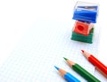 Sharpeners and pencils on a white background. Royalty Free Stock Photo