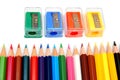 Sharpeners and pencils on a white background. Royalty Free Stock Photo