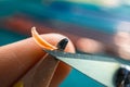 Sharpening blunt pencil with art knife on finger Royalty Free Stock Photo