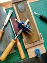 Sharpening chisels using sandpaper and honing guide.