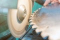 Sharpening Circular Saw, worker sharpens a circular saw blade Royalty Free Stock Photo