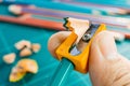 Sharpening pencil with sharpener, marco picture Royalty Free Stock Photo