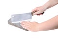 Sharpening or honing a knife on a waterstone, grindstone in woman hand on the white background