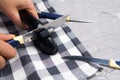 Sharpening a knife. Close-up of a man using a sharpener to sharpen a knife blade Royalty Free Stock Photo