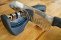 Sharpening a Santoku kitchen knife, using a domestic sharpener.